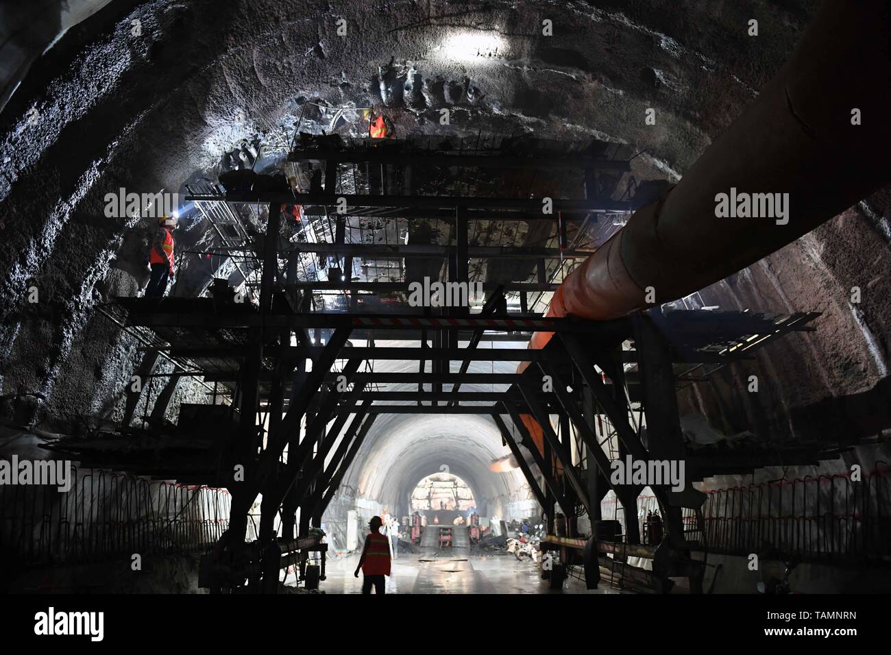 puer-25th-may-2019-constructors-work-at-the-construction-site-of-dajianshan-railway-tunnel-of-the-yuxi-mohan-railway-in-southwest-chinas-yunnan-province-may-25-2019-credit-yang-zongyouxinhuaalamy-live-news-TAMNRN.jpg