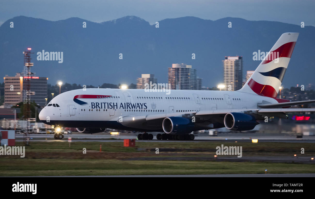 May 19, 2019 - Richmond, British Columbia, Canada - A British Airways Airbus A380-841 (G-XLEL) jetliner takes off at dusk from Vancouver International Airport. (Credit Image: © Bayne Stanley/ZUMA Wire) Stock Photo