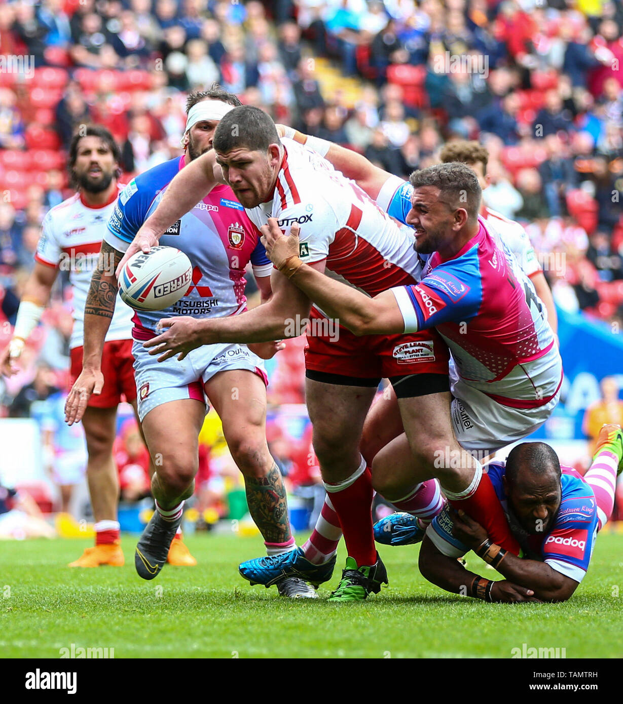 Anfield, Liverpool, UK. 26th May, 2019. Rugby League Dacia Magic Weekend; Mitch Garbutt of Hull KR is tackled by Adam Walker and Robert Lui of Salford Red Devils Credit: Action Plus Sports/Alamy Live News Stock Photo