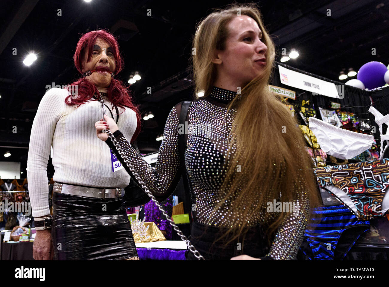 Los Angeles, California, USA. 15th Mar, 2019. A woman walks a man on a leash during RuPaul's DragCon LA 2019 in Los Angeles, California. The annual three-day RuPaul's DragCon is the world's largest drag culture convention and takes place in New York and Los Angeles. Credit: Ronen Tivony/SOPA Images/ZUMA Wire/Alamy Live News Stock Photo