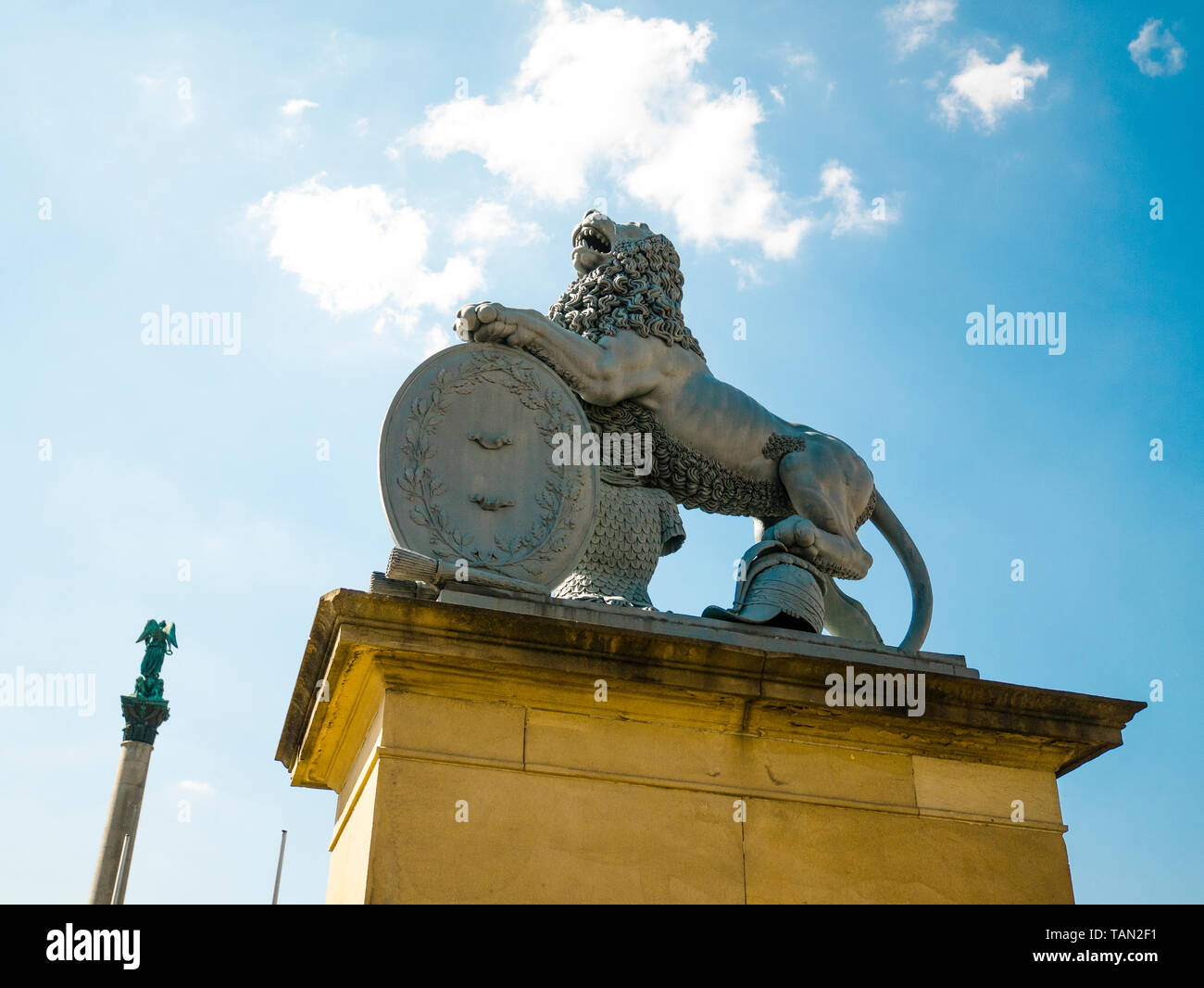 Lion statue, Neues Schloss behind the fountain, domicile of the Ministry of Finance, palace in Schlossplatz square, Stuttgart, capital of the state of Stock Photo