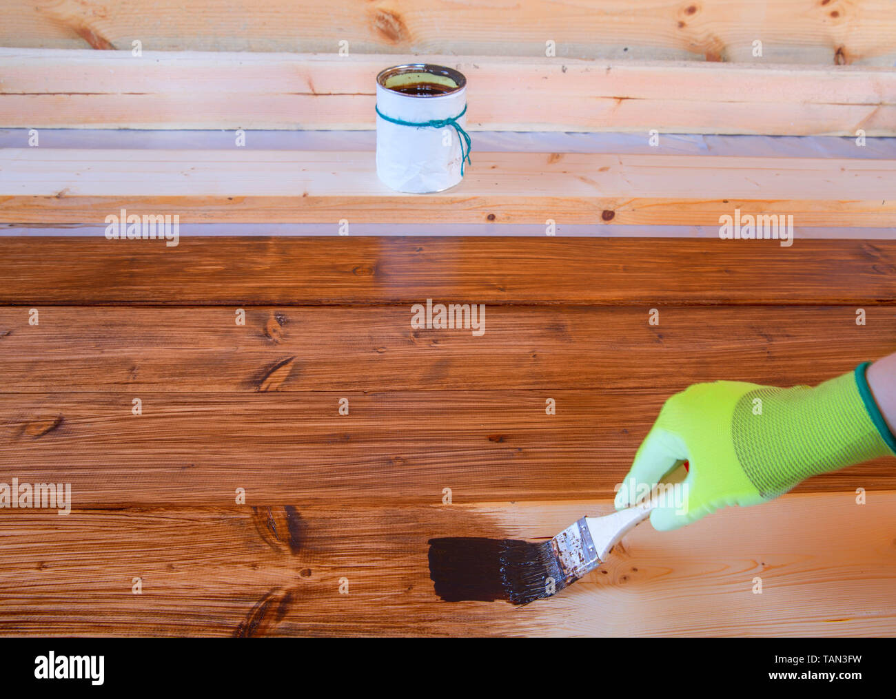 The process of painting wood surfaces with a brush Stock Photo Alamy