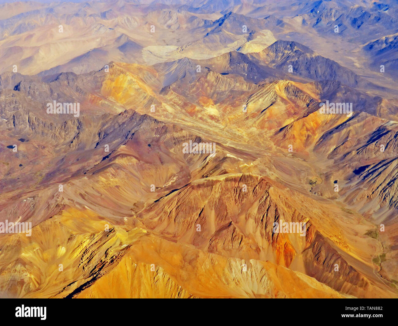 Aerial view of the Andes mountain range with colorful mountains Stock Photo