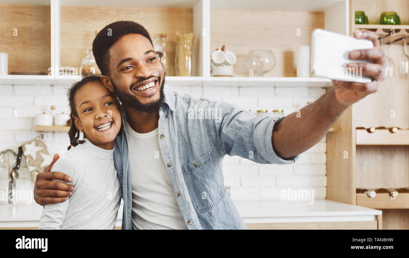 Afro father and daughter make selfie Stock Photo