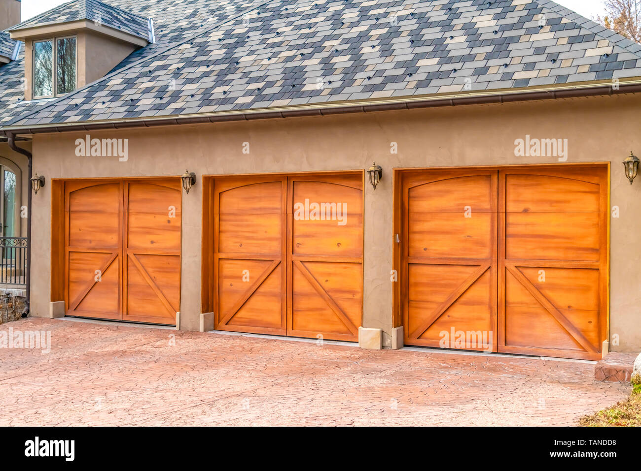 Luxurious Exterior Of A House With Stylish Brown Wooden Garage