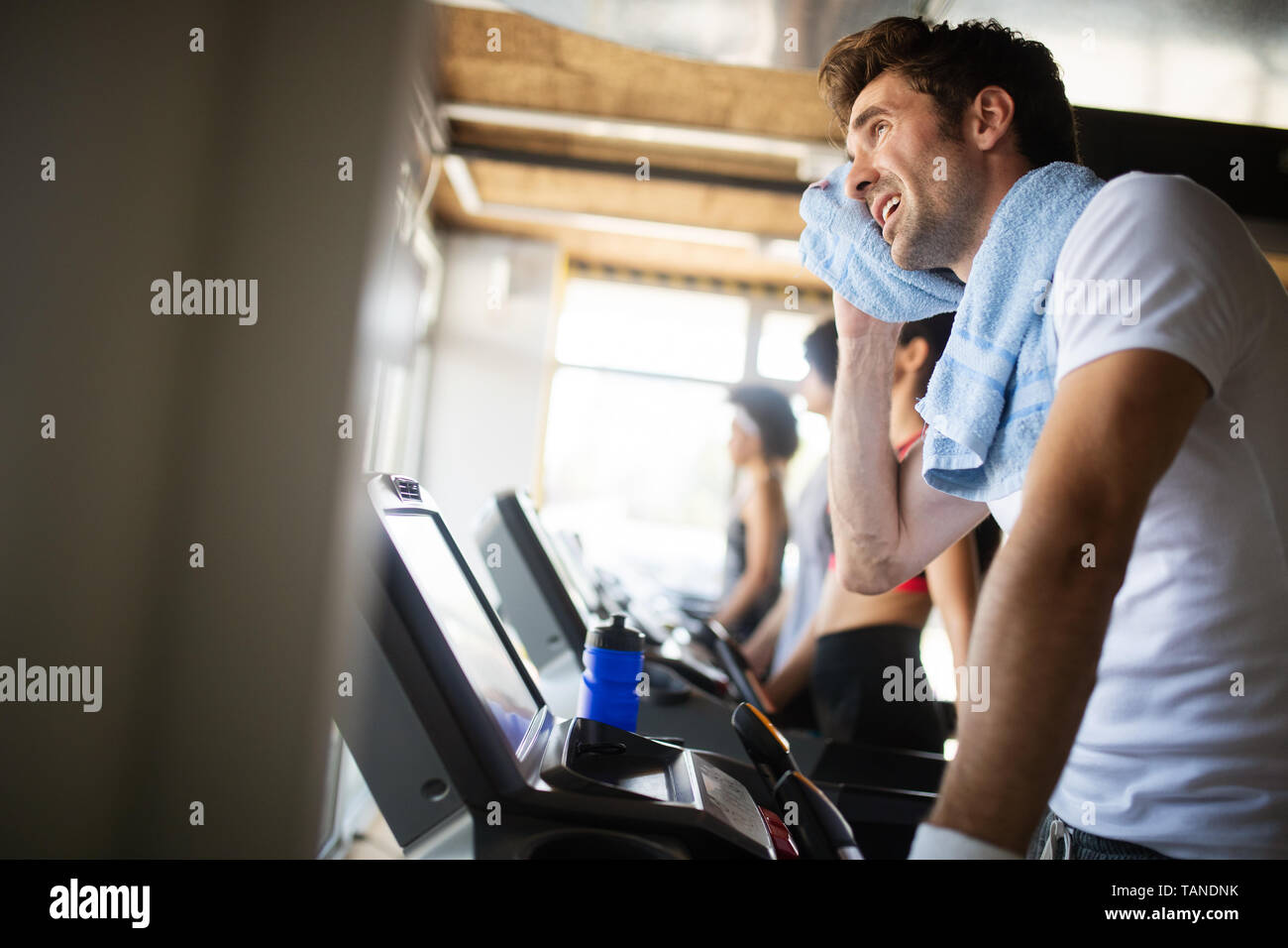 Handsome sporty man resting, having break doing exercise Stock Photo
