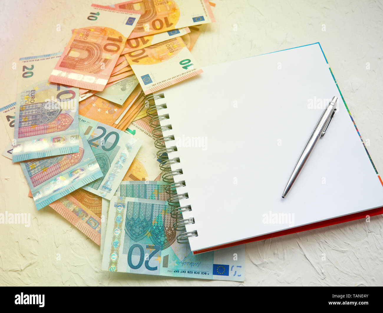 oosters Belonend Celsius money Euro and a notebook with a pen, to dream, to record expenses, home  finances, space for text Stock Photo - Alamy