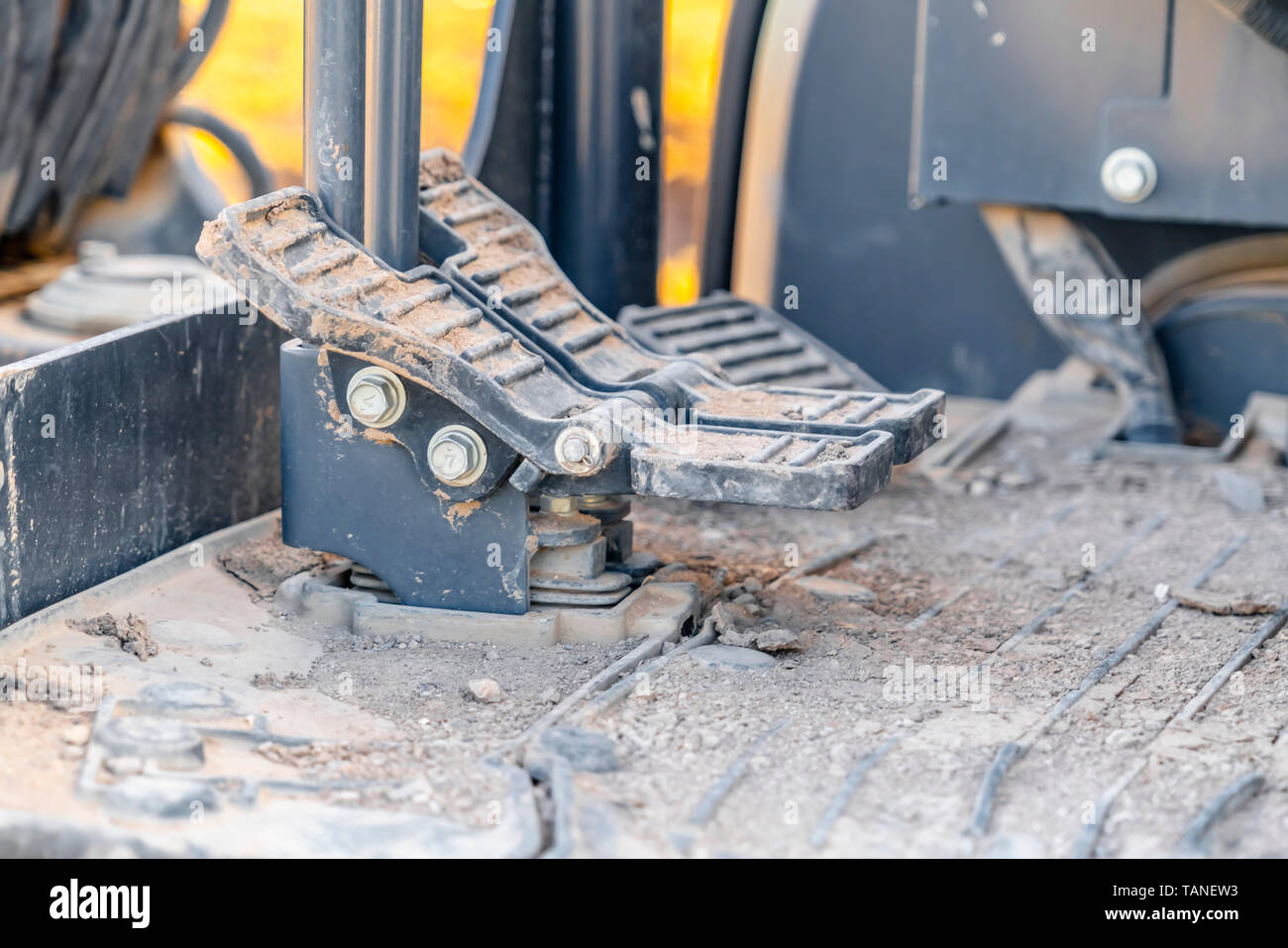 Interior of a construction vehicle with close up on the foot pedals and