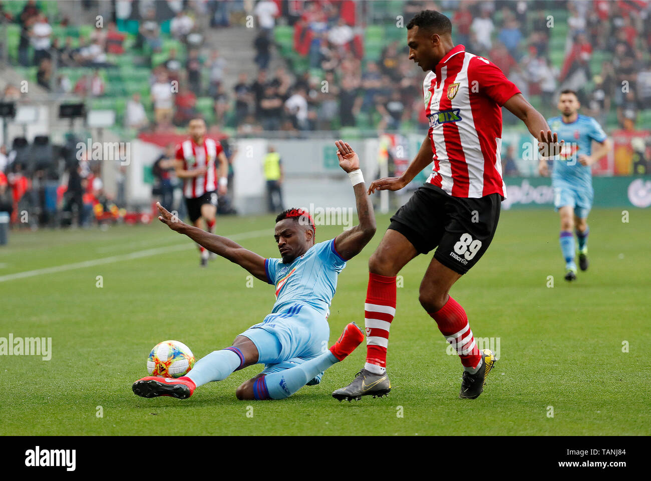 BUDAPEST, HUNGARY - MAY 25: (l-r) Stopira of MOL Vidi FC slide tackles  David N'Gog of Budapest Honved during the Hungarian Cup Final match between  Budapest Honved and MOL Vidi FC at