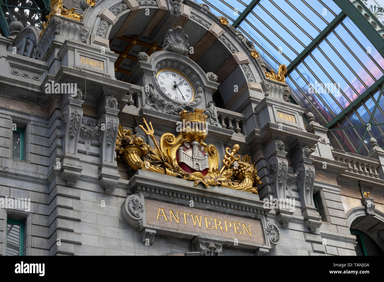 Antwerp, Belgium - July 14, 2018 Large an big clock in the great Hall of the central station in Antwerp with the name in gold letters of the city Stock Photo