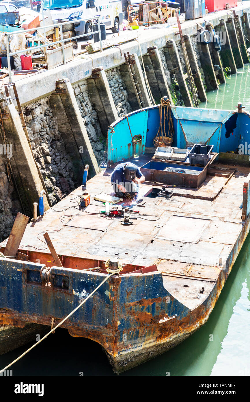 arc welding, Arc welder, welding, welder, arc, weld, welding boat, boat repair, repair, repairing, mending, man, man welding, welding mask, Helmet, Stock Photo