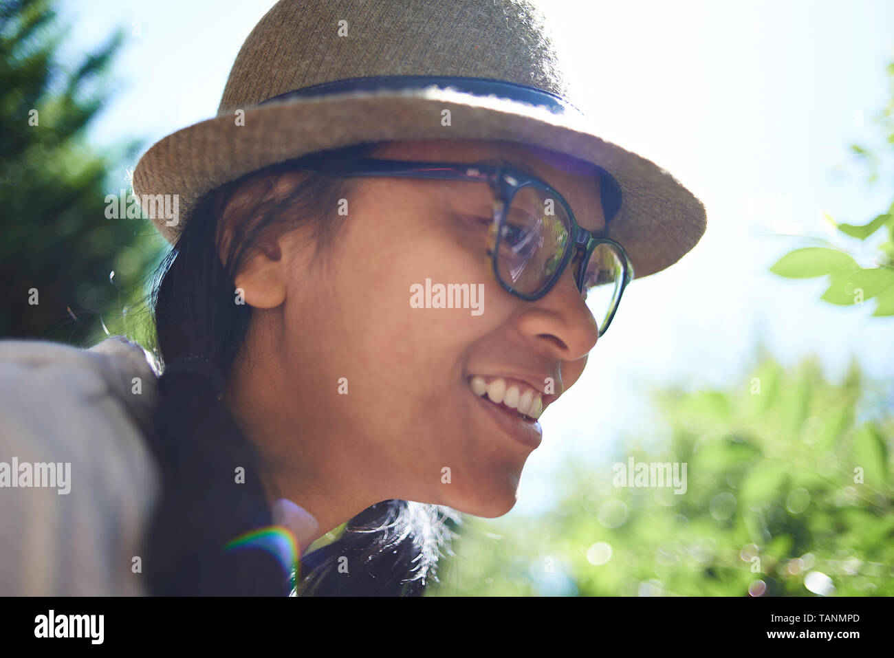 Portrait of a girl wearing a straw hat hi-res stock photography and ...