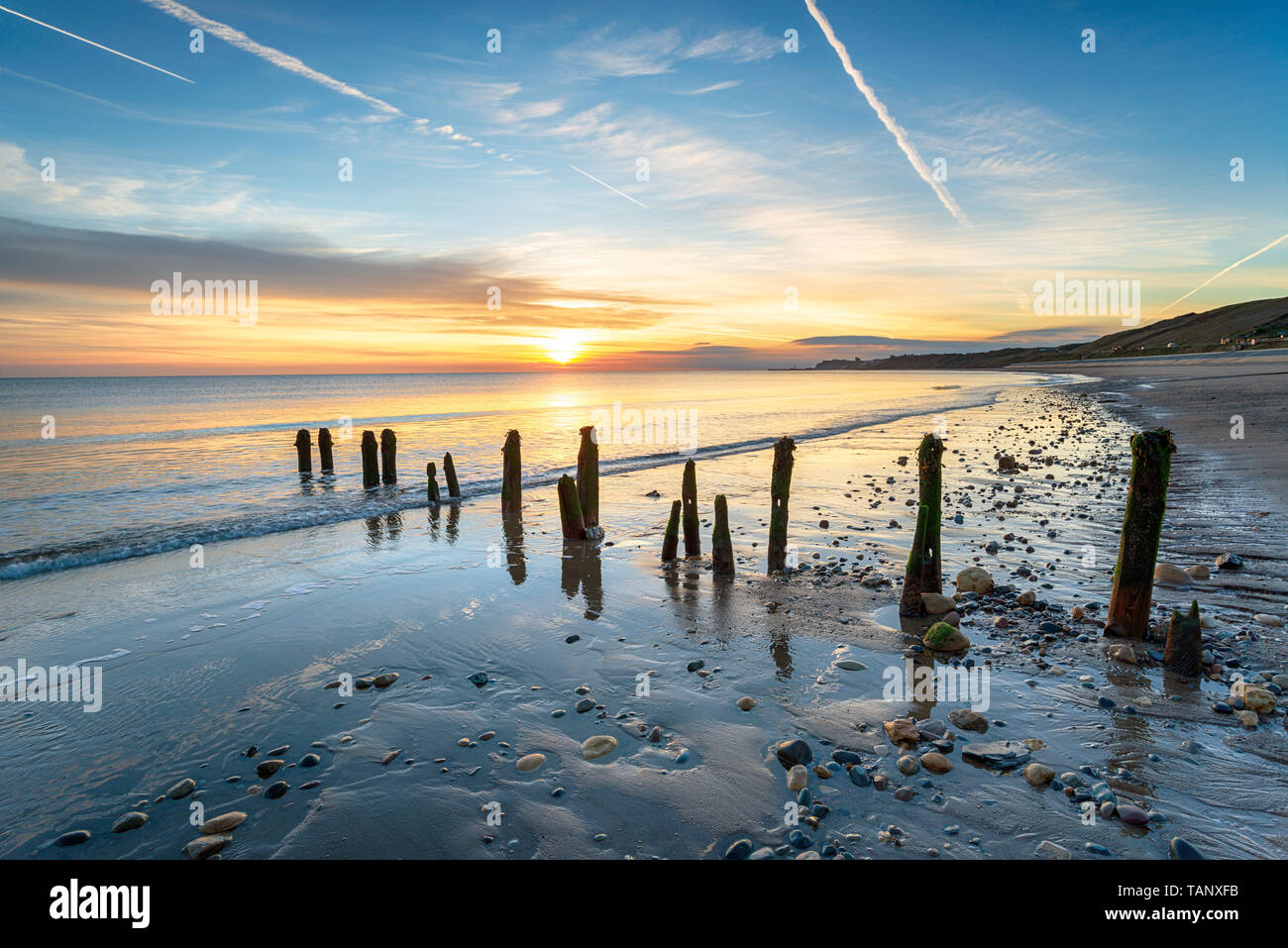 Stunning sunrise at Sandsend Beach just outside of Whitby on the Yorkshire heritage coastline Stock Photo