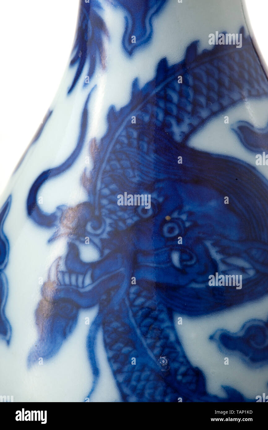 A blue-white baluster vase, Qianlong Period (1736-96) White porcelain with blue underglaze depicting dragons between clouds over the ocean. On the base a blue underglaze Quianlong mark. Fine, undamaged condition. Height 22 cm. Provenance: South German private collection, purchased in the 1960/70s. historic, historical, China, Chinese, Additional-Rights-Clearance-Info-Not-Available Stock Photo