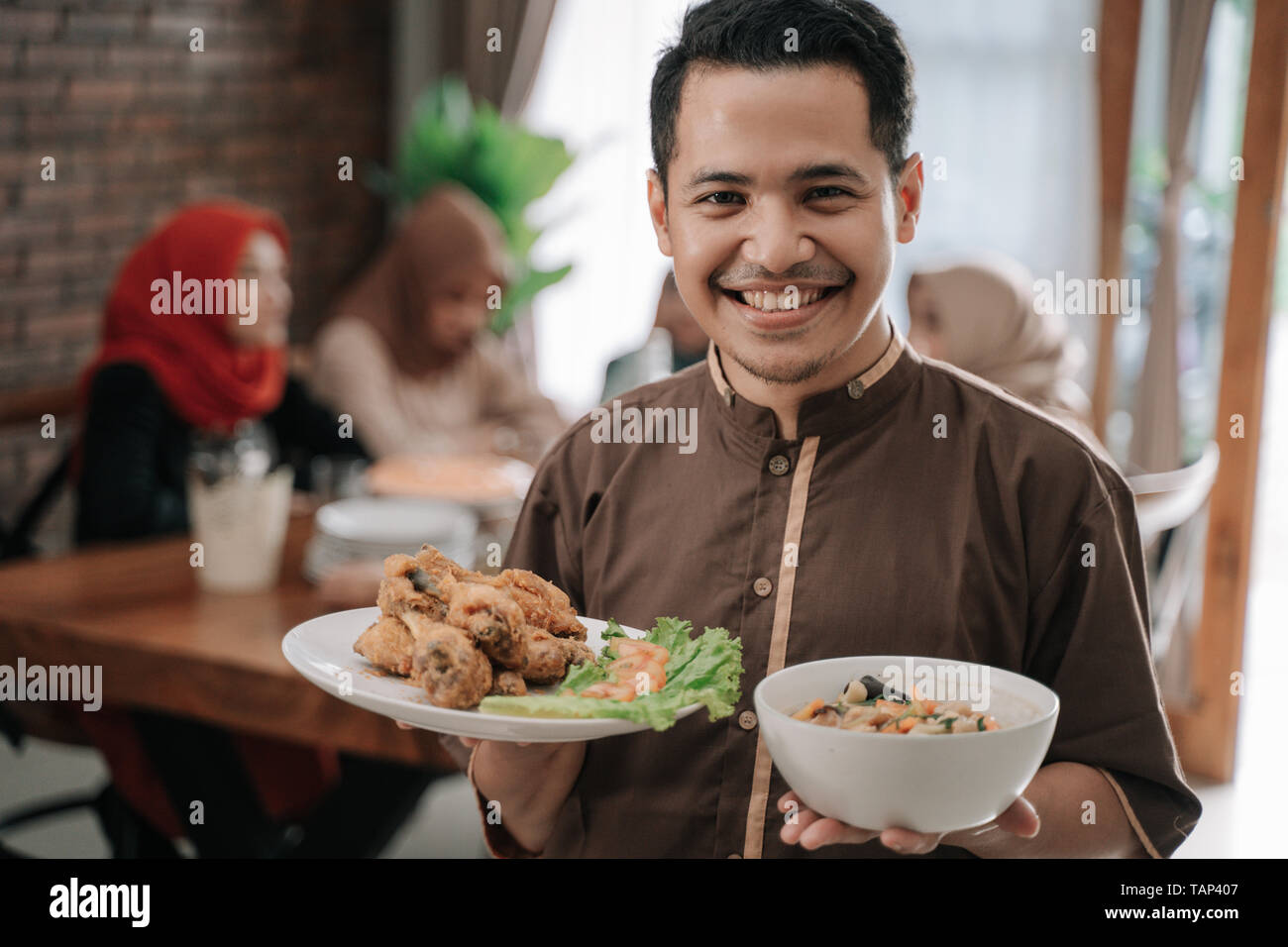 Father brings a fast breaking dish Stock Photo Alamy