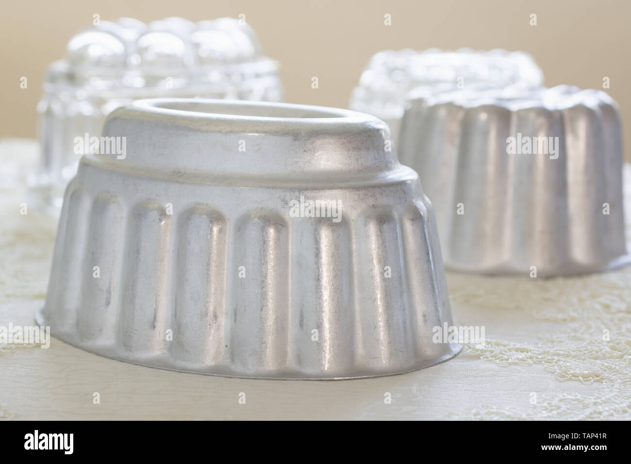 Vintage aluminum and glass jelly or blancmange moulds for making traditional jellies Stock Photo