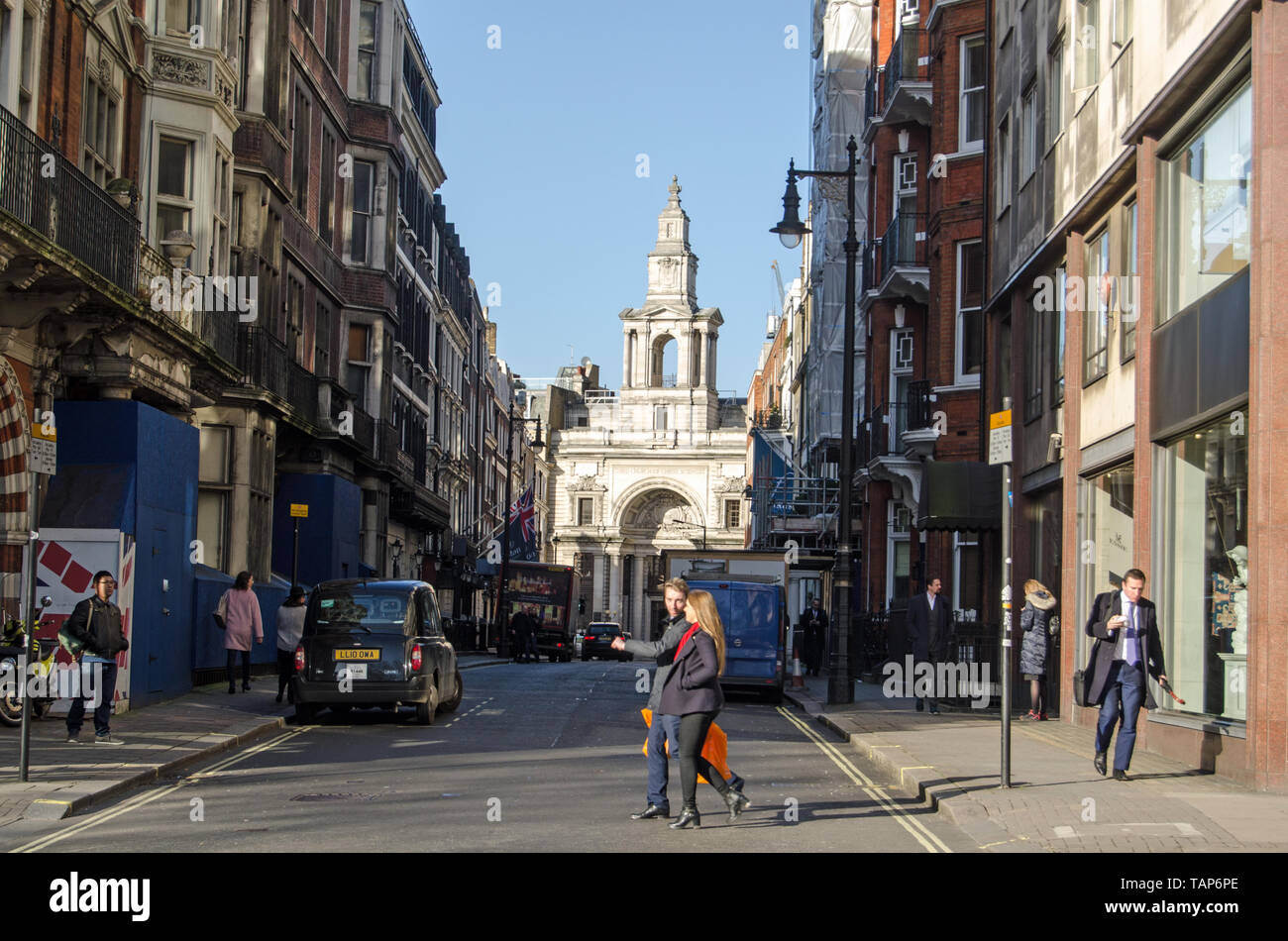 LONDON, UK - JANUARY 28, 2016: Pedestrians and traffic on Half Moon Street in Mayfair, London. View from Piccadilly towards Curzon Street and the land Stock Photo