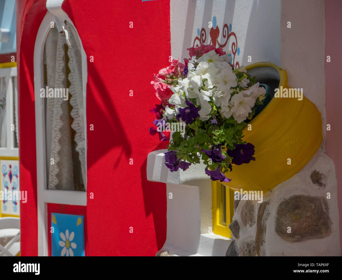 Beautiful greek village streets with flowers decoration Stock Photo - Alamy