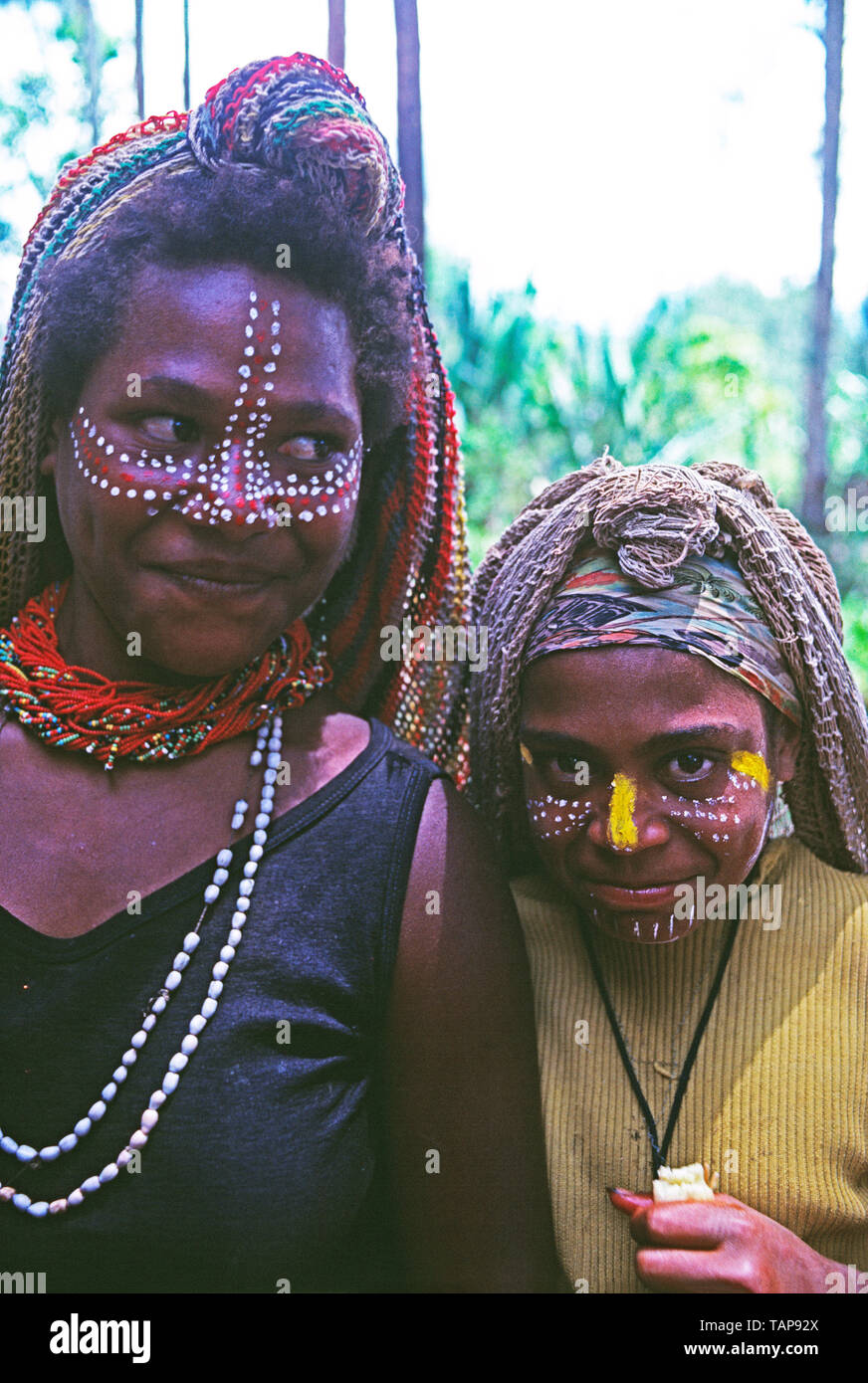 Papua New Guinea. Sepik River. Young tribal woman and girl. Stock Photo