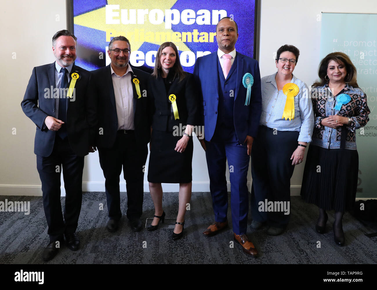 Newly elected MEPs L-r Alyn Smith, Christian Allard, Aileen McLeod, Louis Stedman-Bryce, Sheila Ritchie and Nosheena Mobarik at the European Parliamentary elections count at the City Chambers in Edinburgh. Stock Photo