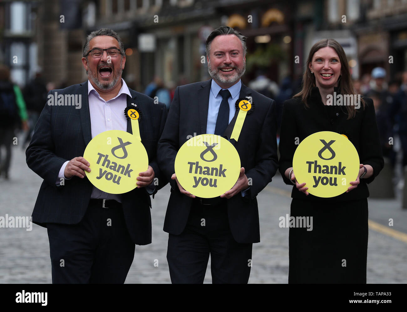 Newly elected SNP MEPs L-r Christian Allard, Alyn Smith and Aileen McLeod on the Royal Mile after the European Parliamentary elections count at the City Chambers in Edinburgh. Stock Photo