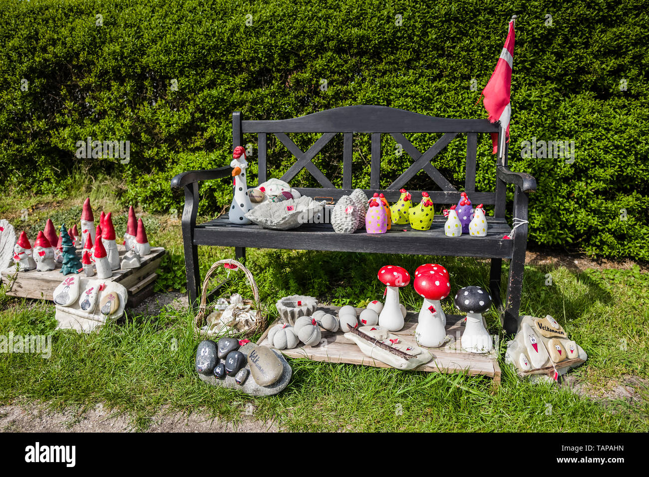 Quirky garden ornaments for sale in a village, Denmark Stock Photo Alamy