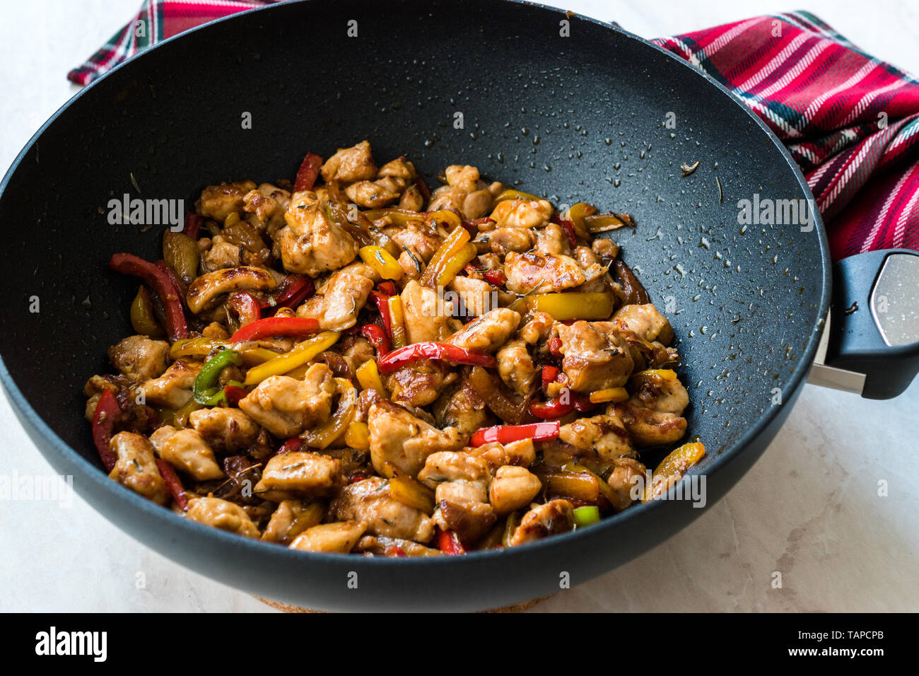 Manchurian Chicken with Soy Sauce, Julienne Vegetables in Iron Wok Pan / Asian  Style Cooking. Traditional Recipe Stock Photo - Alamy