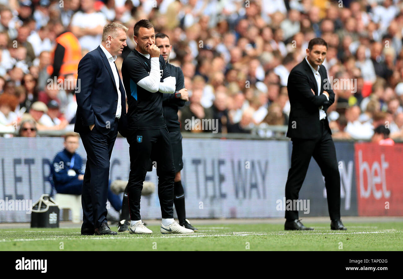 Aston Villa manager Dean Smith (left), assistant coach John Terry (second  left) and Derby County's manager Frank Lampard (right) during the Sky Bet  Championship Play-off final at Wembley Stadium, London Stock Photo -