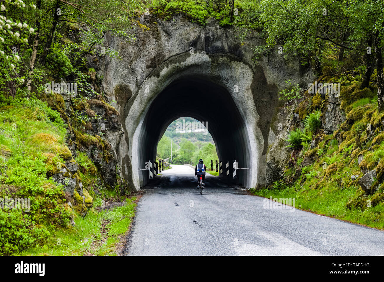 Wet weather cycling in Norway Stock Photo