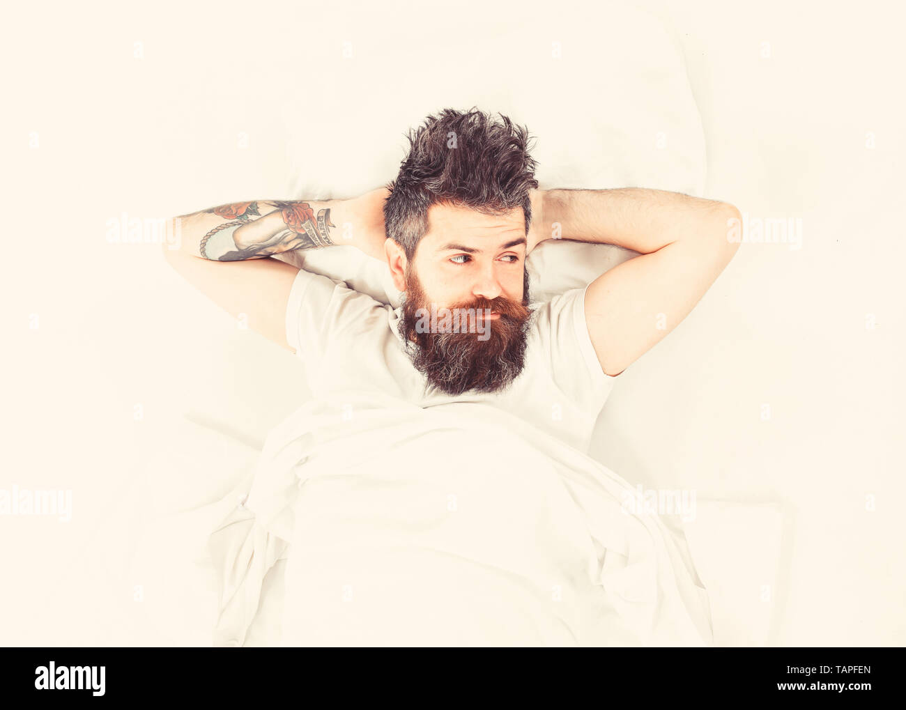 Man With Pensive Face Wake Up Lay On Bed Put Hands Behind Head