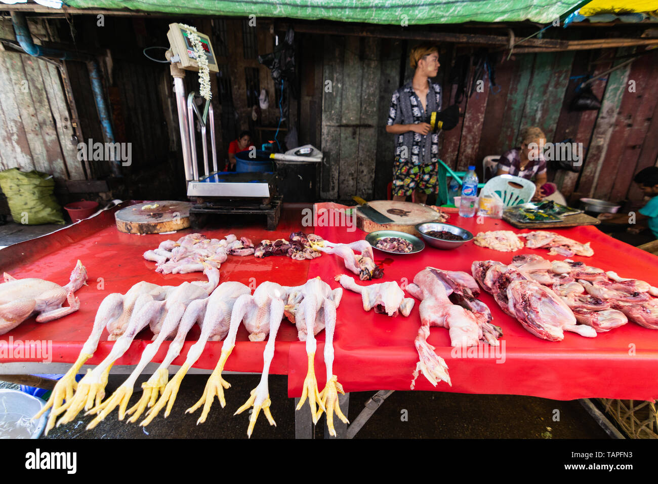 Butcher stalls at the open street market in Yangon, Myanmar. Stock Photo