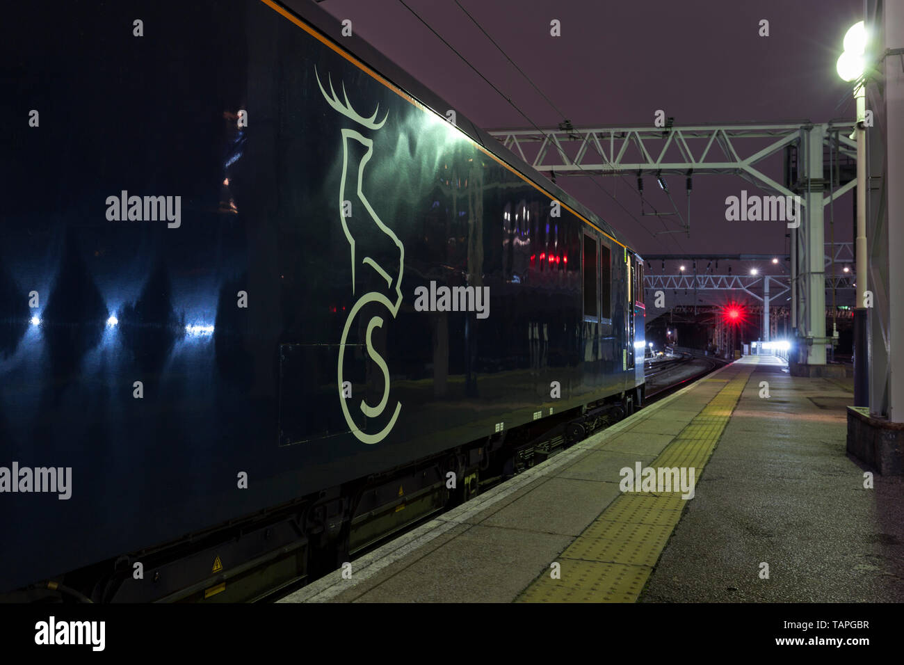 2116 London Euston - Inverness, Aberdeen & Fort William highland Caledonian sleeper train at London Euston station sowing the logo on the locomotive Stock Photo