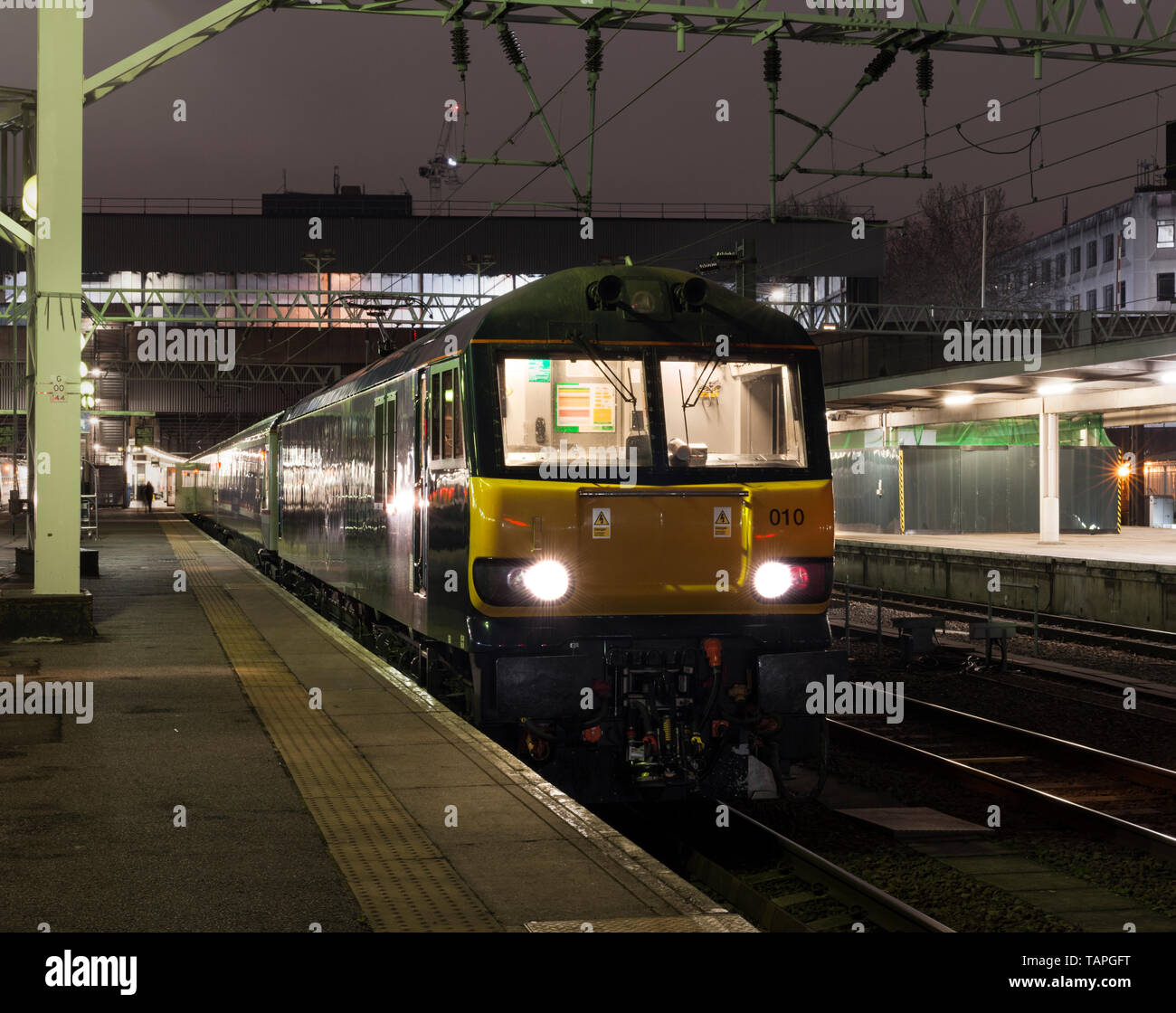 The 2116 London Euston - Inverness, Aberdeen & Fort William highland Caledonian sleeper train waiting to depart from London Euston station at night Stock Photo