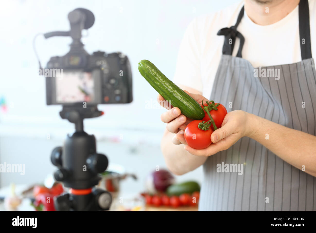 Comic Culinary Blogger Holding Organic Vegetables Stock Photo