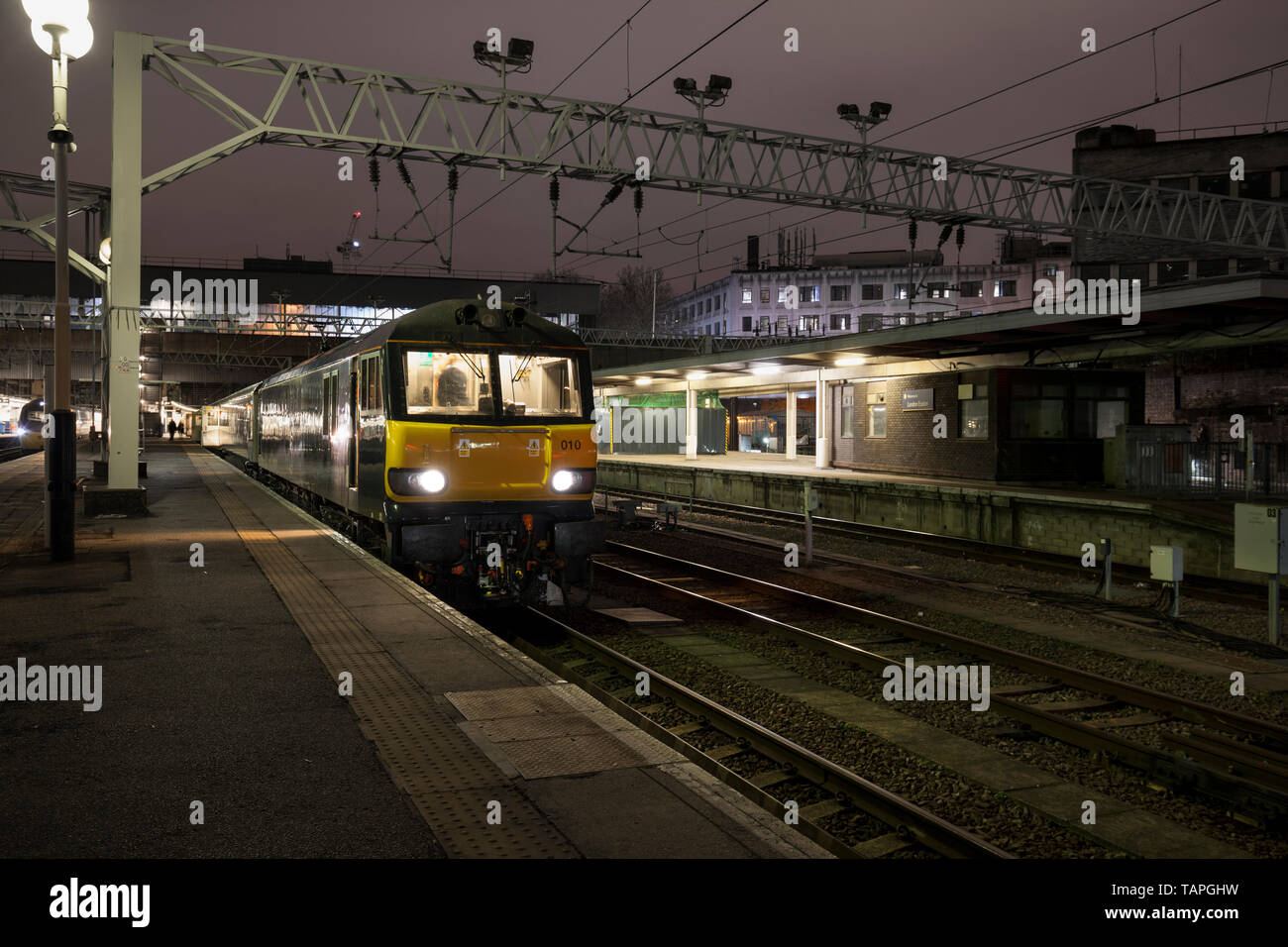 The 2116 London Euston - Inverness, Aberdeen & Fort William highland Caledonian sleeper train waiting to depart from London Euston station at night Stock Photo