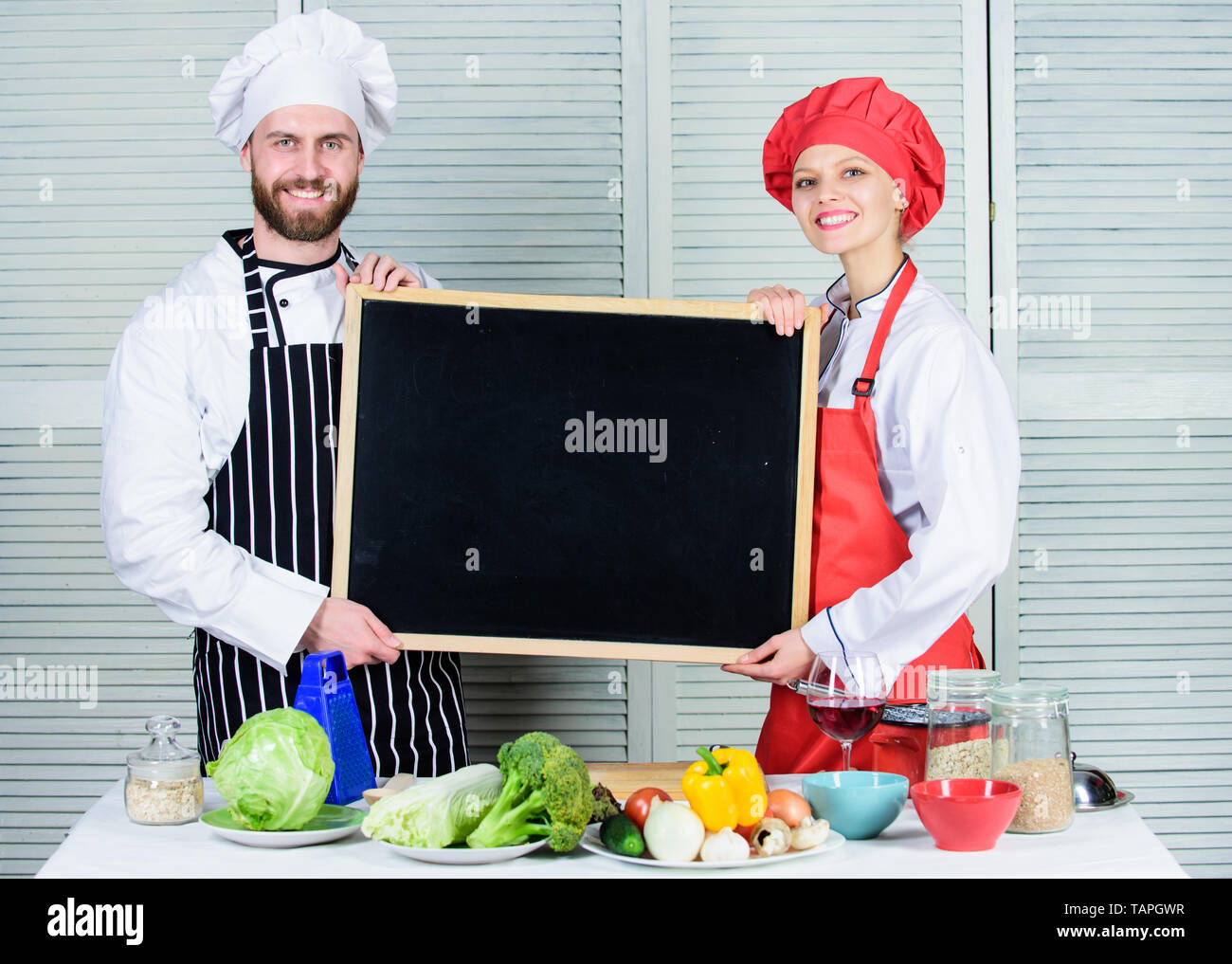 Hands on cooking class. Couple of man and woman holding empty ...