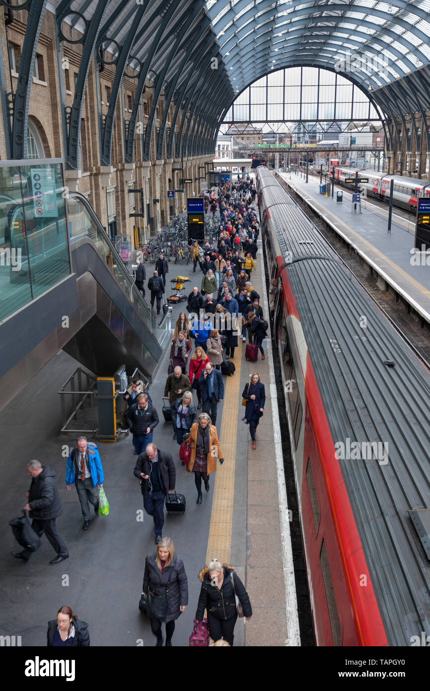 Passengers leaving a LNER, London North eastern railway train at London