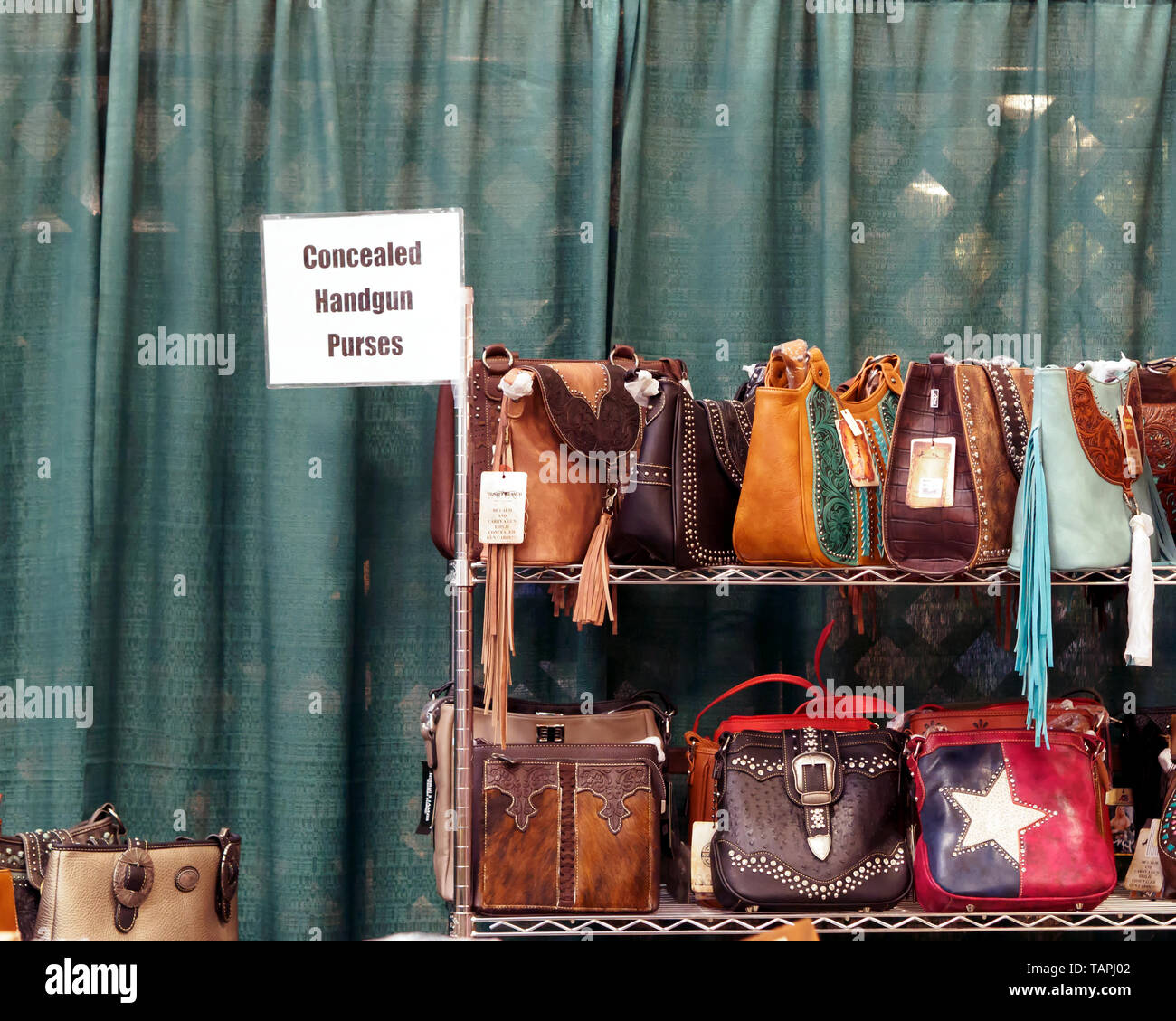 Concealed handgun purses for sale at the Country Peddler Show. Richard M. Borchard Regional Fairgrounds Robstown, Texas USA. Stock Photo