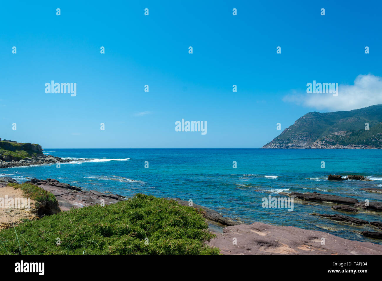 Landscape of the coast near Porto Ferro beach, in Sardinia, in a sunny day Stock Photo