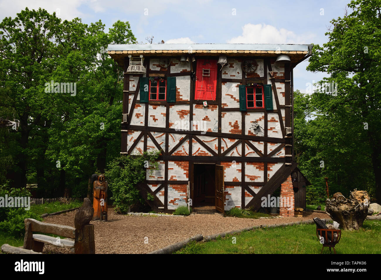 THALE, SAXONY-ANHALT, GERMANY - MAY 24, 2019: Witch's cottage upside down at the Witches' Dance Floor above Thale in the Harz mountains. Family fun. Stock Photo