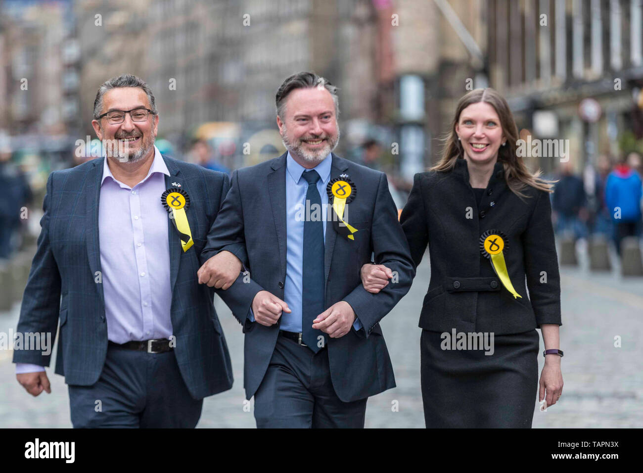 The results of the European Parliamentary Elections for the Scotland Region are announced at the City Chambers in Edinburgh. Scotland's six new MEPs will be the SNP's Alyn Smith, Christian Allard and Aileen McLeod, Louis Stedman-Bruce of the Brexit Party, Sheila Ritchie of the Liberal Democrats and Baroness Nosheena Mobarik of the Conservatives. Pictured: The three SNP MEP's celebrate their victory Stock Photo