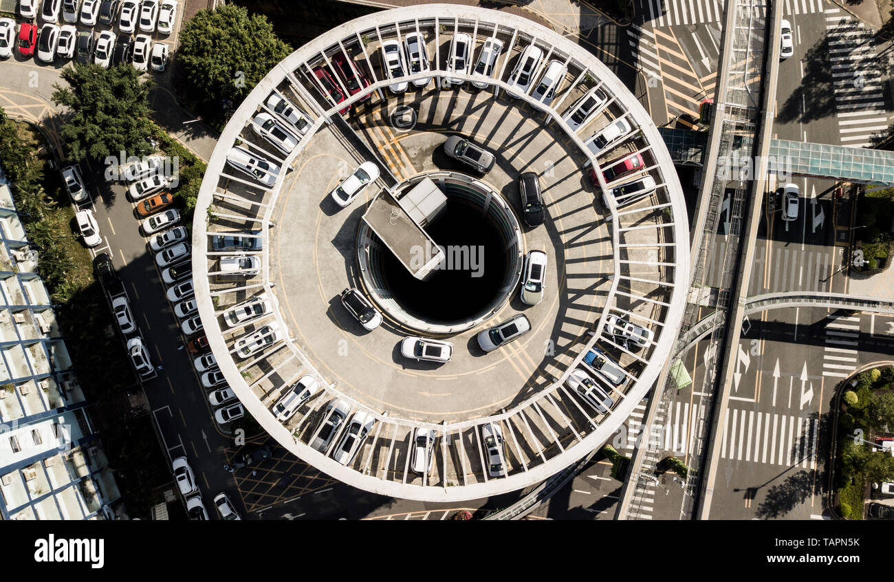 Beijing, China. 30th Nov, 2018. Aerial photo taken on Nov. 30, 2018 shows a 'charging tower' for electric vehicles at the headquarters of China's new energy vehicle maker BYD in Shenzhen, south China's Guangdong Province. Recent financial reports released by many markets indicate that the increase in R&D investment has boosted enterprises' performances. Credit: Mao Siqian/Xinhua/Alamy Live News Stock Photo