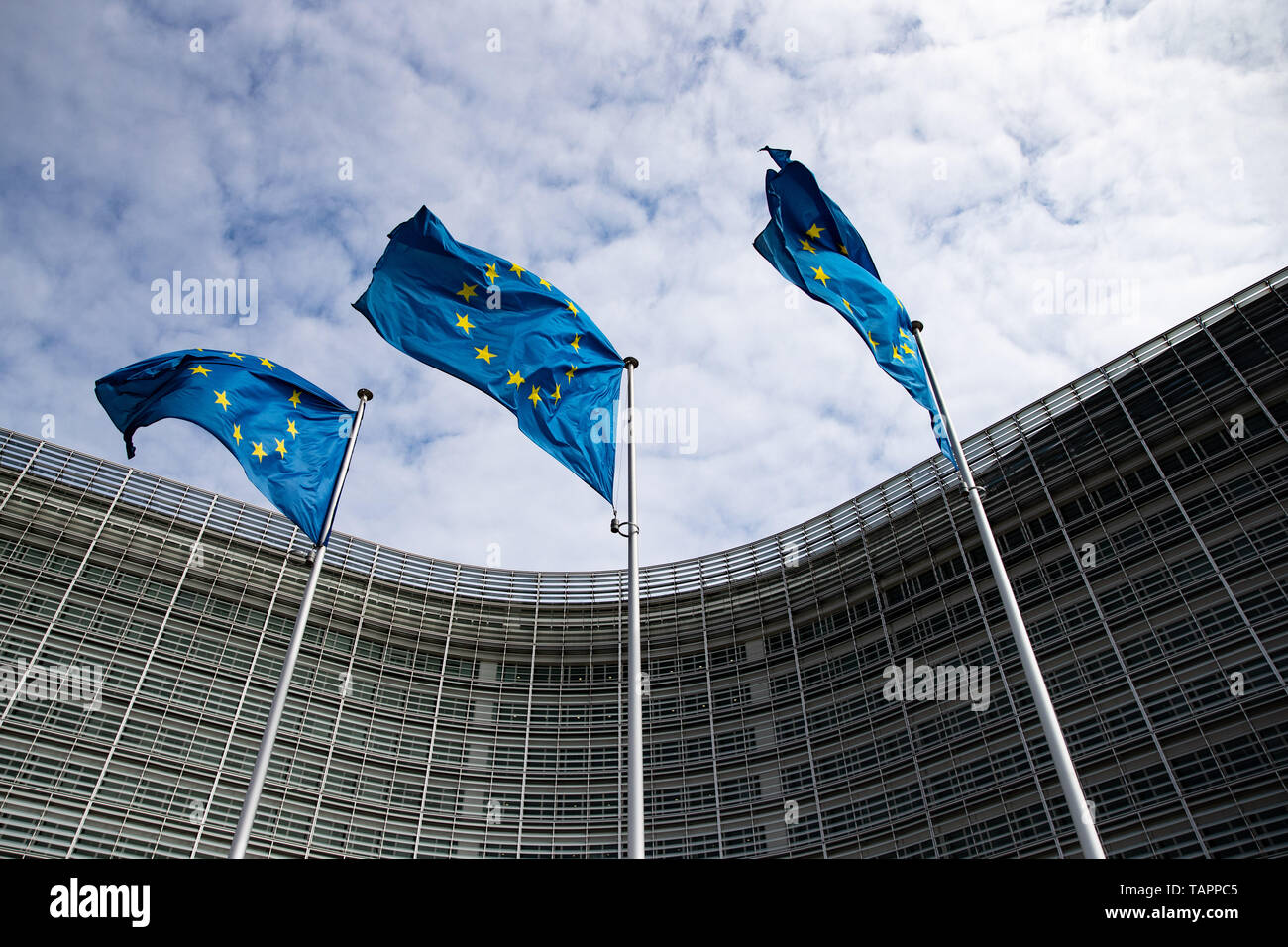26 May 2019, Belgium, Brüssel: European flags flutter in the wind in front of the Berlaymont building, the seat of the European Commission. From 23 May to 26 May, the citizens of 28 EU states will elect a new parliament. Photo: Marcel Kusch/dpa Stock Photo
