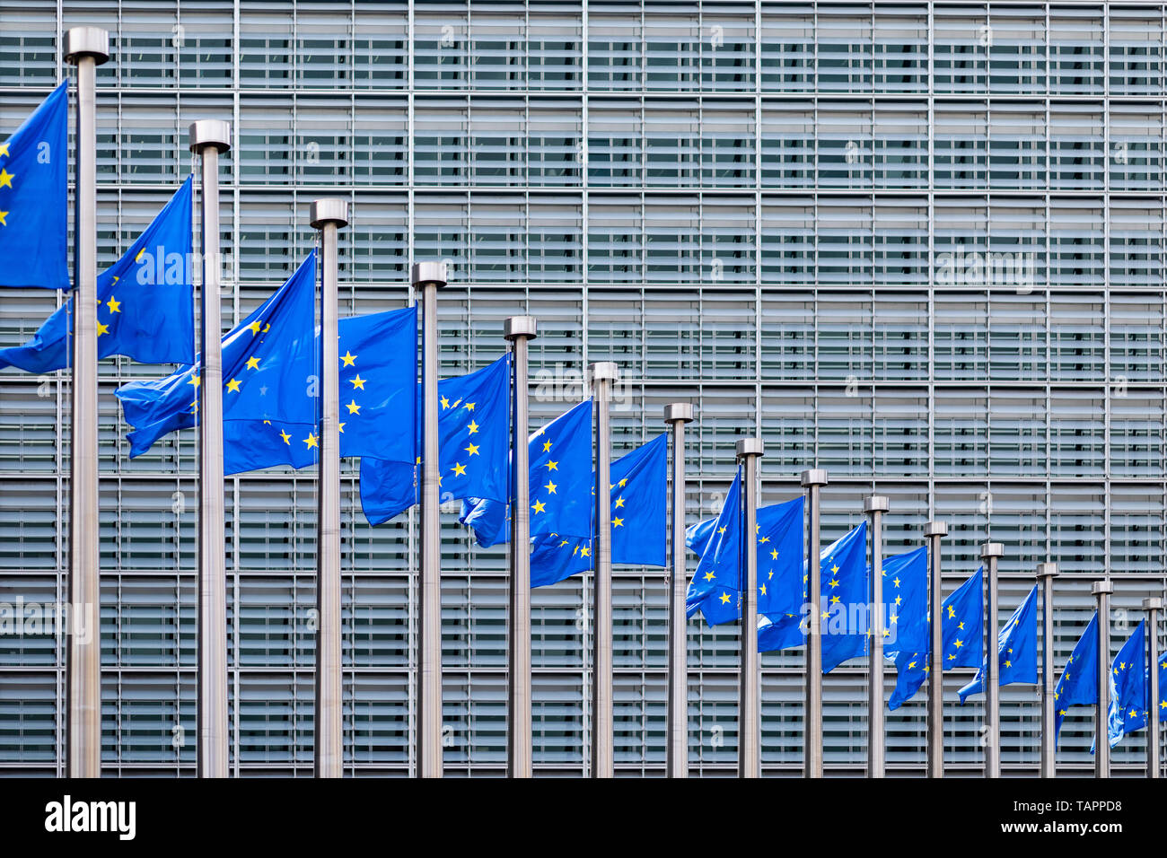 26 May 2019, Belgium, Brüssel: European flags flutter in the wind in front of the Berlaymont building, the seat of the European Commission. From 23 May to 26 May, the citizens of 28 EU states will elect a new parliament. Photo: Marcel Kusch/dpa Stock Photo
