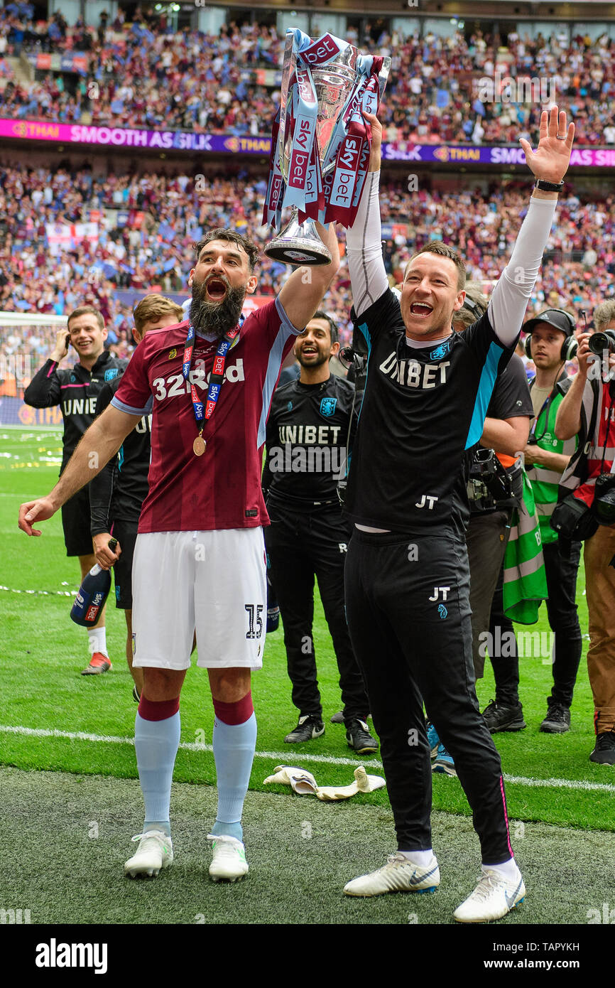 London, UK. 27th May, 2019. Mile Jedinak (15) of Aston Villa and Aston Villa's John Terry celebrate with the trophy during the Sky Bet Championship match between Aston Villa and Derby County at Wembley Stadium, London on Monday 27th May 2019. (Credit: Jon Hobley | MI News) Credit: MI News & Sport /Alamy Live News Stock Photo