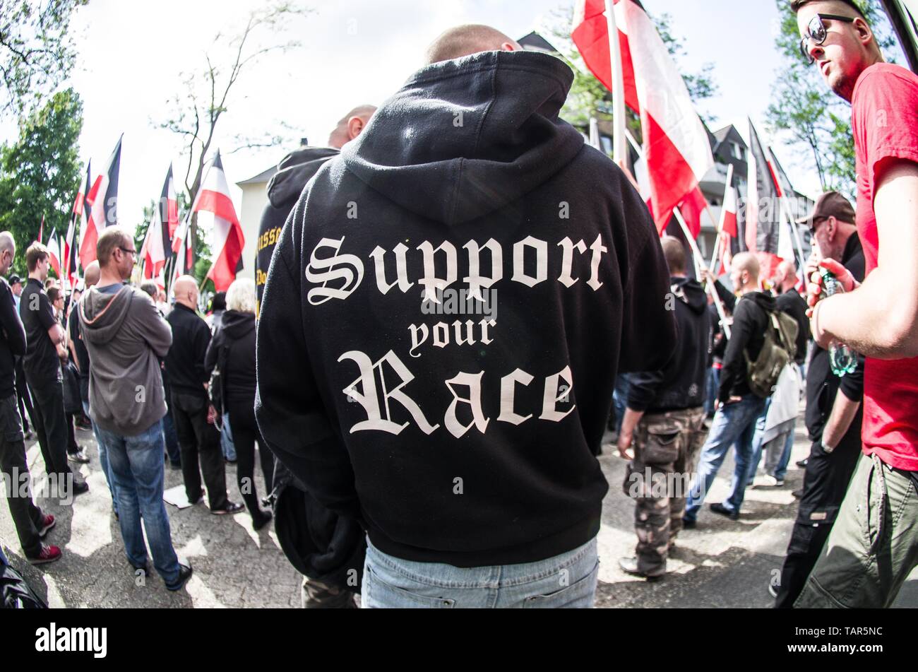 Dortmund, Nordrhein Westfalen, Germany. 25th May, 2019. ''Support your race'' worn by a neonazi at an event in Dortmund, Germany. Prior to the European Elections, the neonazi party Die Rechte (The Right) organized a rally in the German city of Dortmund to promote their candidate, the incarcerated Holocaust denier Ursula Haverbeck. The demonstration and march were organized by prominent local political figure and neonazi activist Michael Brueck (Michael BrÃ¼ck) who enlisted the help of not only German neonazis, but also assistance from Russian, Bulgarian, Hungarian, and Dutch groups with the Stock Photo