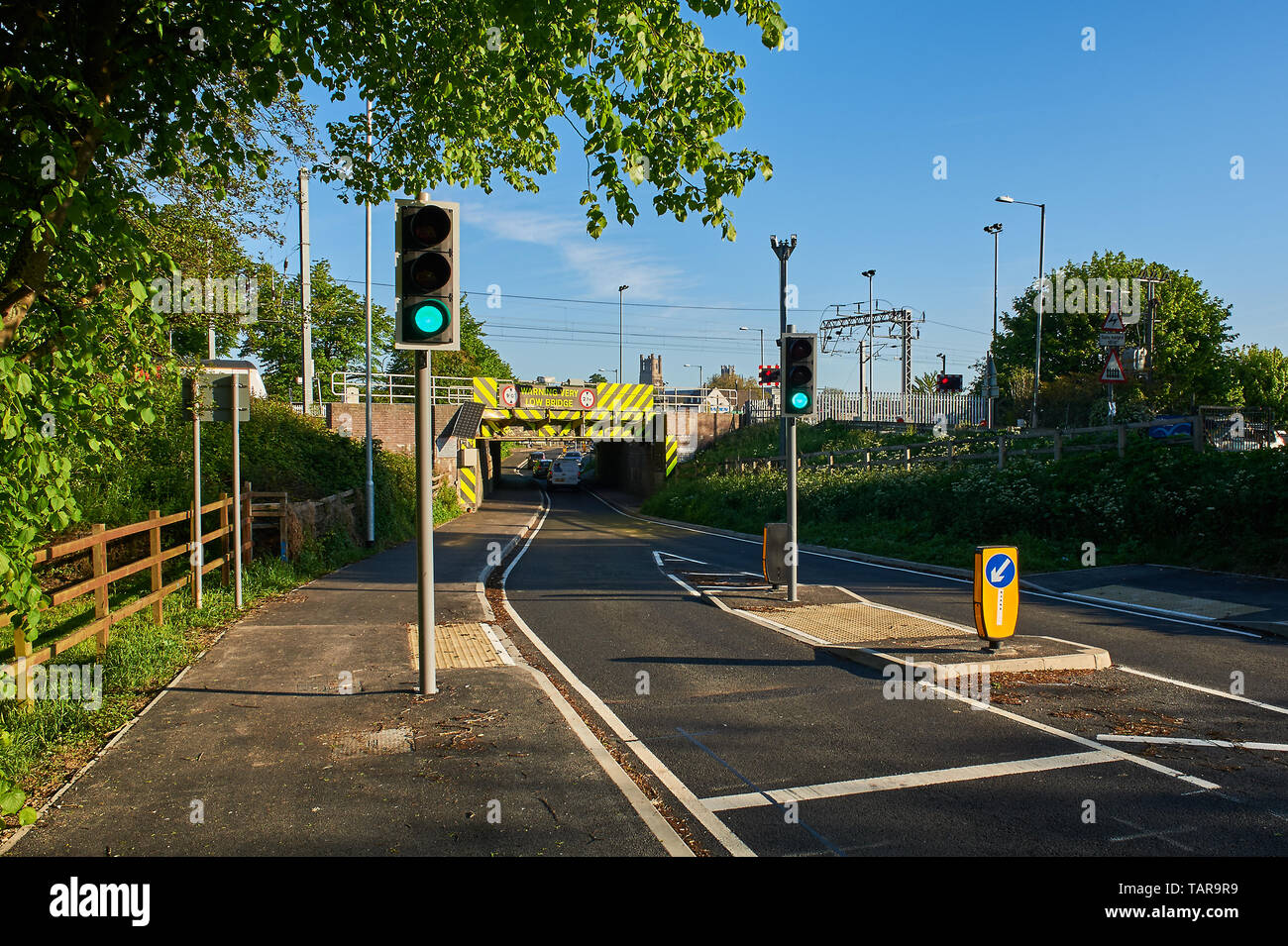 Traffic lights and new road layout to avoid a low bridge over the road Stock Photo