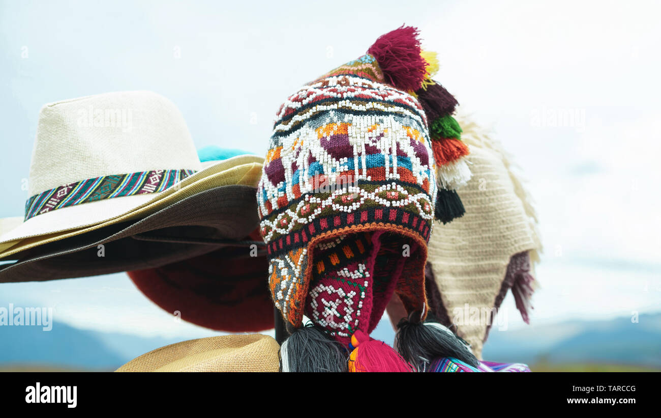 Peruvian traditional colorful native handicraft textile hats at the market in Machu Picchu, one