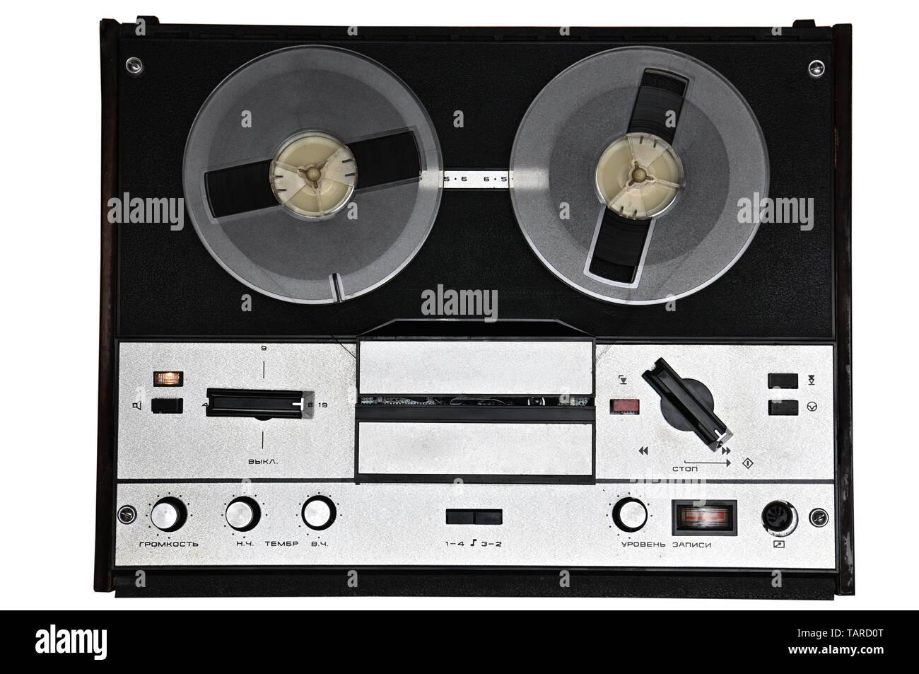 Vintage reel to reel tape recorder on isolated white background