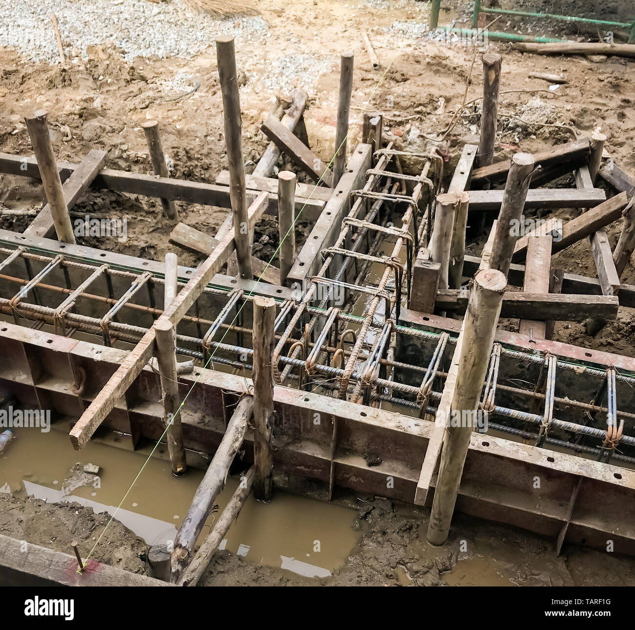 Starting pouring wet concrete in to a house foundation construction site Stock Photo Alamy